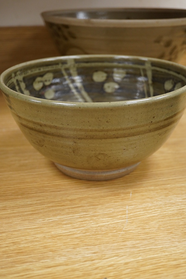 Three studio pottery bowls, one signed ‘A’ to the base, largest 34cm in diameter. Condition - good